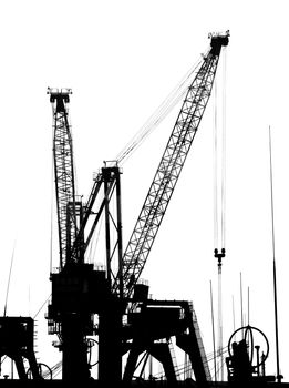 Cranes in silhouette at the docks pf Kaohsiung Port
