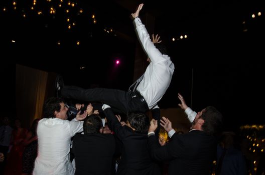 Groom in the air, funny moments of a wedding