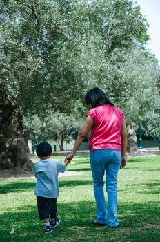 Mother and son walking in the woods