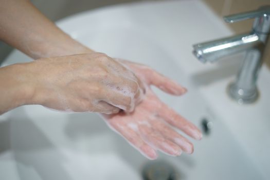 Washing hands with soap. For killing germs, bacteria and virus.