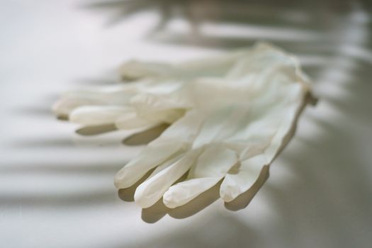 Pair of white latex medical gloves