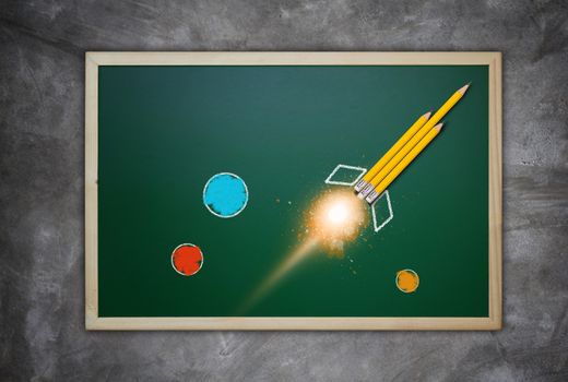 Education concept, knowledge management, yellow pencil rocket on chalkboard background
