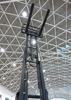 A large forklift truck with elevated blades