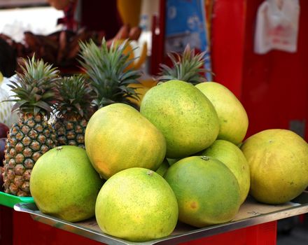 Pomelos for sale at the market. They are also called Chinese grapefruit or shaddock