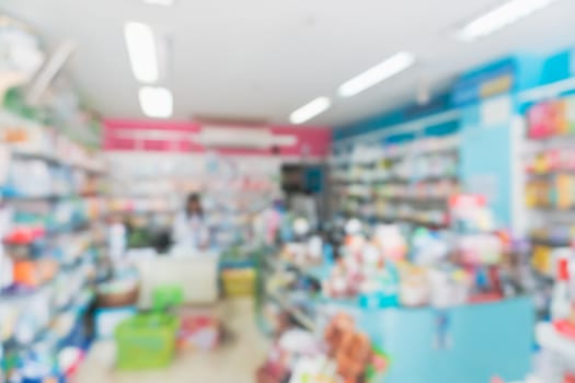 Blur modern pharmacy store shop bright tone abstract blurry background.