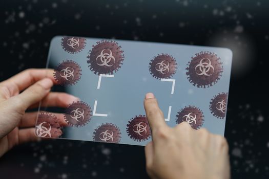 Hand holding and showing virus on tablet device.