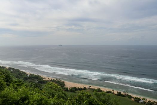 Bubble hotel at Nyang Nyang Beach on Bali Island, Indonesia. Romantic place ideal for honeymoon. A high reef off the coast of the Indian Ocean overgrown with dense tropical vegetation. Rainforest.