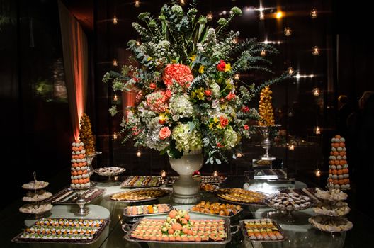 Decorating a candy table at a wedding