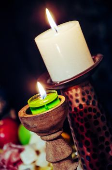 Closed plane of candles on some wooden candlesticks