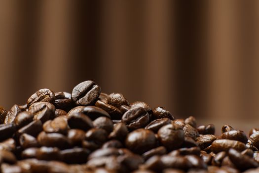 Roasted Coffee Beans texture on Curtain background, macro.