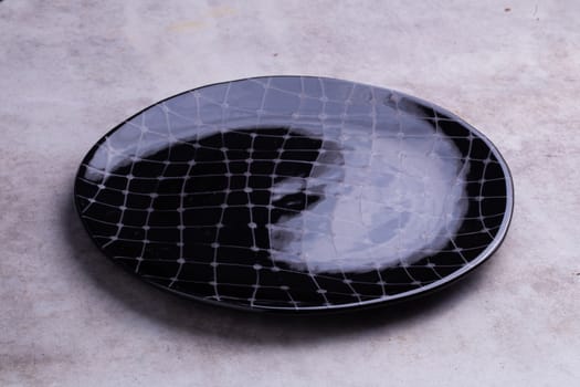 Empty blank ceramic dish isolated on white background