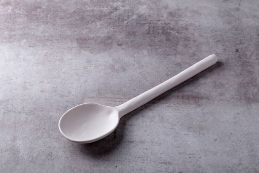 Empty blank white spoon ceramic on Cement Board.