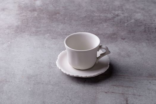 Teapot creamer, Cup and saucer on Cement Board.