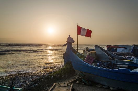 Boat with the flag of Peru on the beach Pescadores in Chorrillos, Lima - Peru