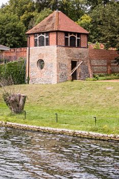 Built in 1663, the Gazebo of Caversham Court in Oxfordshire remains the oldest riverside building in the Thames Valley. Viewed from the River Thames, Reading, Berkshire.