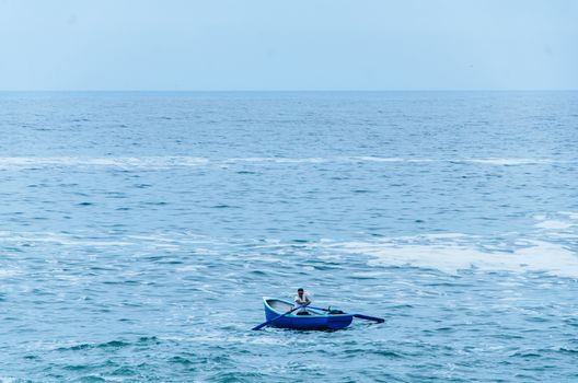 Boatman sailing on the beaches of Lima - Peru