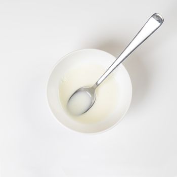 a white cup of milk isolated