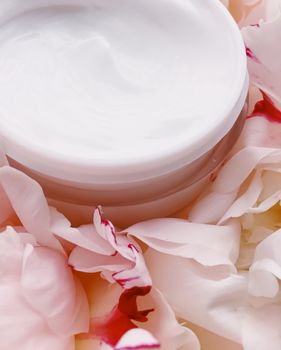 Face cream moisturizer on floral background as luxury skincare cosmetics, healthcare and beauty product concept