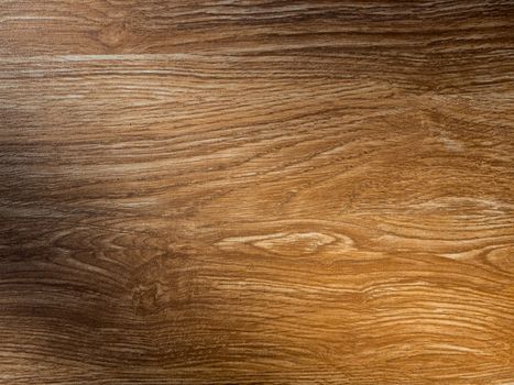 Empty wooden table background texture with light and shadow on surface, top view.