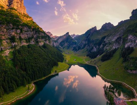 Aerial view of the Seealpsee lake and the Grenzchopf mountain in the Appenzell region of Swiss Alps at sunset
