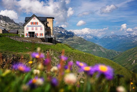 Furka Pass, Switzerland - July 21, 2019 : Historic hotel Furkablick built in 1892 in the Furka pass. The Furka Pass is a high mountain pass in the Swiss Alps with an elevation of 2429m.