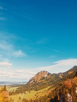 Beautiful nature of European Alps, landscape view of alpine mountains, lake and village in autumn season, travel and destination scenery