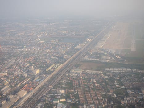 Bangkok / Thailand - 24 January 2020: high view from airplane of dusty view, PM 2.5 in the air, pollution in Bangkok city, Thailand.