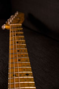 Close up of Electric guitar handle with keys honed and stripped of use