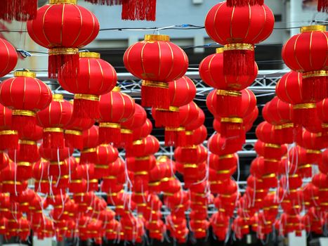 A sea of traditional Chinese lanterns at an outdoor feast