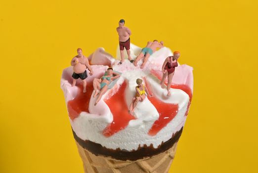 Ice Cream In Waffle Cone and Miniature People on Beach