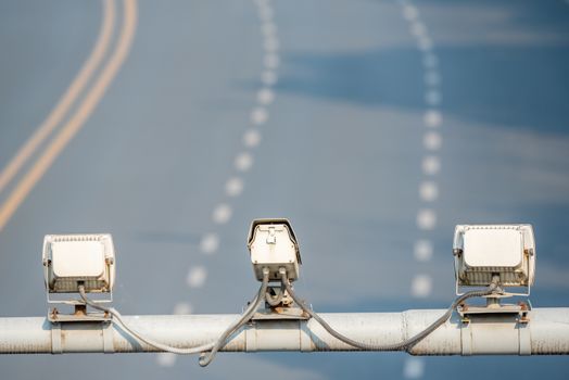 Speed cameras monitoring traffic road above empty road in Chengdu, Sichuan province, China