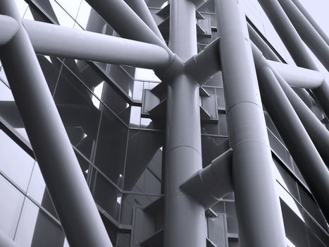 Outside facade of a modern building with massive steel tubes
