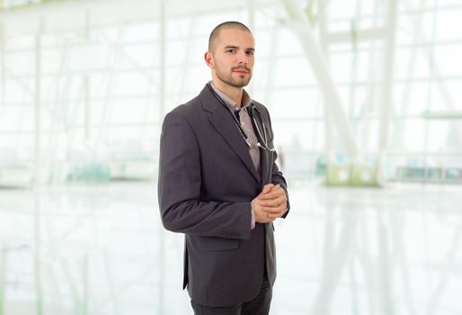 happy male doctor, at the office