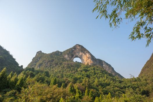 Moon hill arch karst formation in Yangshuo, Guilin, Guangxi province, China