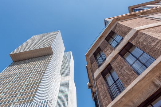 Ancient and modern buildings against blue sky in Rotterdam, Netherlands