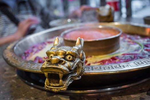 Chengdu Sichuan Hot Pot close up with dragon head sculpted handles, Chenggdu, Sichuan Province, China
