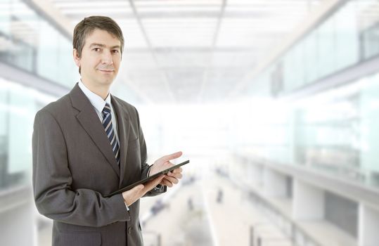 haapy businessman with a tablet pc, at the office