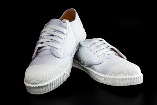 White Sneakers isolated on black background
