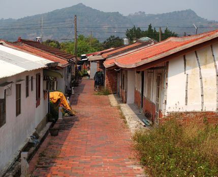 An old Chinese village with a red brick street