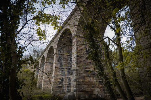 An old stone built British viaduct in the Yorkshire countryside