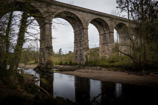 An old stone built British viaduct in the Yorkshire countryside