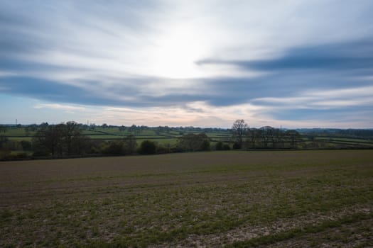 A open farmers field showing the beautiful colors in the sky