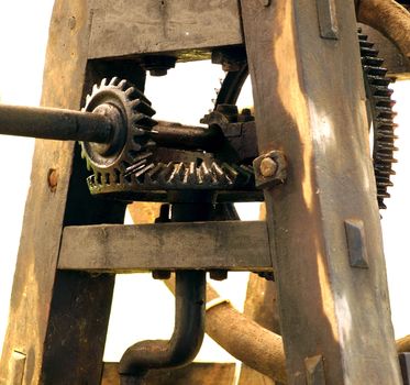 A vintage agricultural machine with gears and transmission
