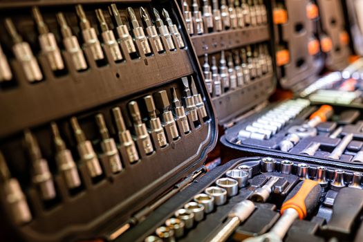 Box with special tools in car repair shop, closeup, selective focus - image