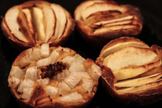 Small homemade apple pies freshly baked each in its mold