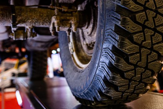 Car lifted in automobile service for fixing - image