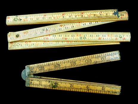 Old style wooden rulers that can be folded up