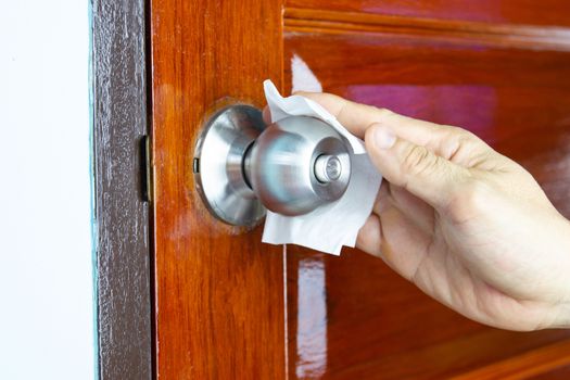 Prevention cleaning Door handles by Disinfectant solution for killing corona virus on touching surfaces, concept coronavirus COVID19