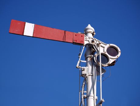 An old semaphore train signal indicating to stop
