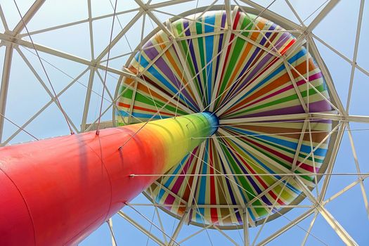 KAOHSIUNG, TAIWAN -- FEBRUARY 19, 2015: An old water tower, a well known landmark in Kaohsiung City, has been painted in bright rainbow colors.
